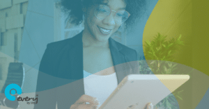 Woman smiling and holding an iPad