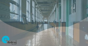 School corridor with a blue and grey overlay and the Every By IRIS logo