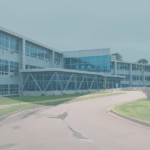 Driveway leading to a large school