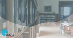 Part of a bookshelf inside a school library with some tables and chairs in the background. A grey Every By IRIS gradient is layered over the image.